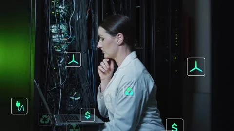 Server tech debugging cables then typing on laptop causing teal energy icons 動画素材 332577703