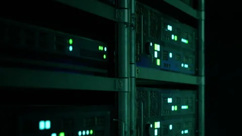 Servers with lights in a dark room in a data center Stock Footage 343555777