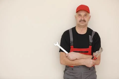 Service and engineering concept. Man hold adjustable wrench and spanner tools Foto stock