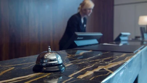 Service bell standing on marble reception desk Stock Footage 74758903