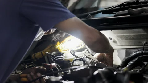 Service Car mechanic use wrenches to repair car In the automotive industry. Stock Footage 146443615