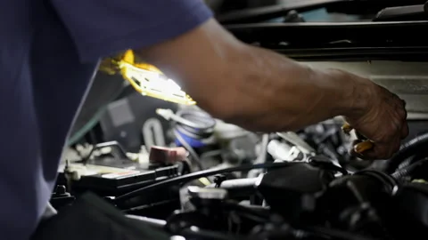 Service Car mechanic use wrenches to repair car In the automotive industry. Stock Footage 146444530