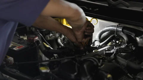 Service Car mechanic use wrenches to repair car In the automotive industry. Stock Footage 146444649