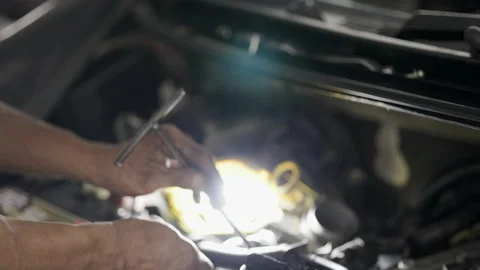 Service Car mechanic use wrenches to repair car In the automotive industry. Stock Footage 146445171
