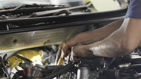 Service Car mechanic use wrenches to repair car In the automotive industry. Stock Footage 146446255