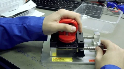 Service center. Electronics repair shops. The repair of the smartphone. Man Stock Footage 82757064