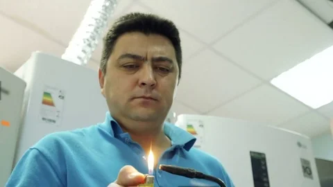 Service center. Electronics repair shops. A man repairs the fridge. Aluminum Stock Footage 82769318