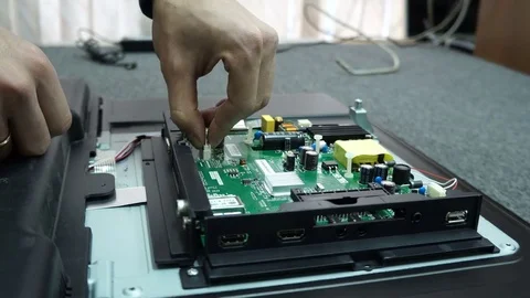 Service center. Electronics repair shops. The man is repairing the TV. Stock Footage 82807868