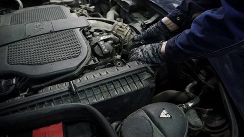 In the service center mechanic to replace the air filter vehicle Stock Footage 71320059