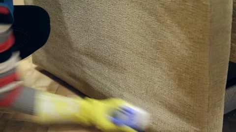 Service cleaning dirty sofa and chairs with special tool Stock Footage 57459781