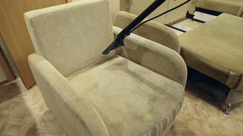 Service cleaning dirty sofa and chairs with special tool Stock Footage 57460923