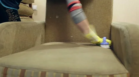 Service cleaning dirty sofa and chairs with special tool Stock Footage 57461227