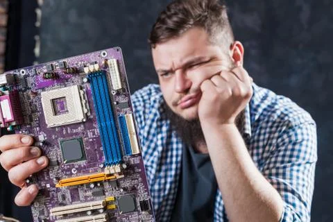 Service engineer fixing problem with motherboard Stock Photos