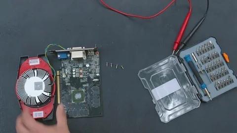 Service engineer inspect graphic card circuit board. Black background. Video stock 76942207