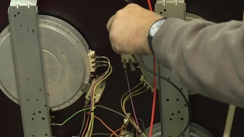 Service engineer testing and repairing a cooker. Close up of male hands. Stock Footage 146806505