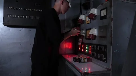 A service engineer works or repairs industrial equipment at an old factory. Stock Footage 311154049