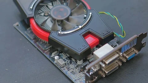 Service man removing cooling system and diagnosing graphic card with multimeter. Video stock 76942201