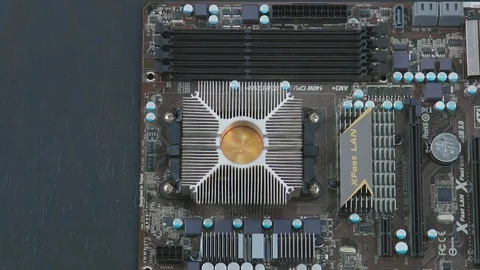 Service man removing cooling system from motherboard. Video stock 76942214