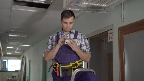 Service man uses technical endoscopes for inspection of ventilation Stock Footage 116349989