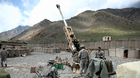 Service members providing fire support in Konar province in Afghanistan - 2010 Stock Footage 107989886