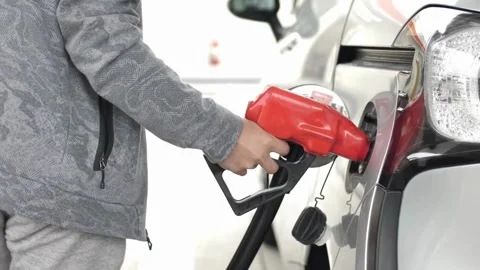 Service staff customer Handle pumping gasoline fuel nozzle to refuel. Vehicle Vidéo 336561730
