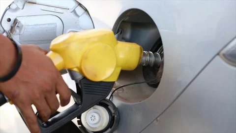 Service staff Handle pumping gasoline fuel nozzle to refuel. Vehicle fueling Видео 336569735