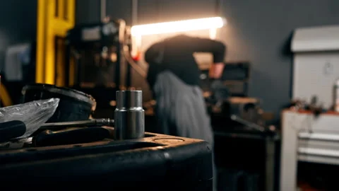 At service station in the foreground there are parts to be repaired in the Stock Footage 276109573