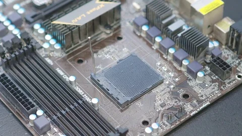 Service technician deinstalling CPU (central processing unit) from motherboard. Video stock 76942182