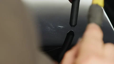 Service technician uses knockdown tool to repair defect of car Stock Footage 316183505
