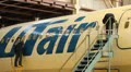 Service Utair aircraft in the hangar. Repair. Airport HD Footage