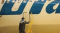 Service Utair aircraft in the hangar. Repair. Airport HD Footage