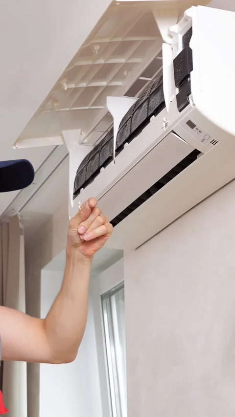 Service Worker Extracts Dirty Air Conditioner Filter From Mounted Indoor Unit Stock Footage 346989104