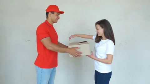 Service worker in uniform delivering parcels to woman. Man holding boxes 스톡 동영상 112760009