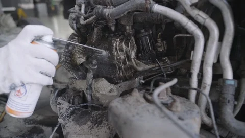 Serviceman applies a cleaning fluid on the engine components Stock Footage 94251084