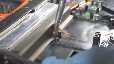 Serviceman cleans the laptop from dust with a brush slow mo Video stock 87303758