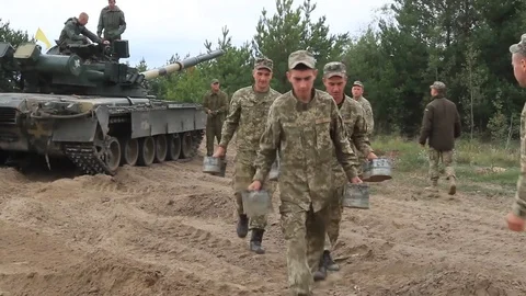Serviceman near their tanks during the Ukrainian Army exercises on the field. Video stock 80367227