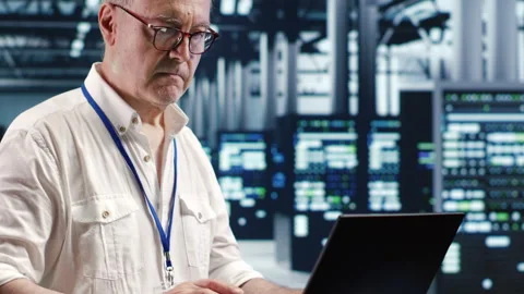 Serviceman optimizing data center Stock Footage 248648677