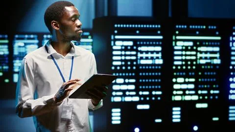 Serviceman in server hub 스톡 사진