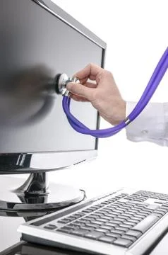 Serviceman testing a computer with stethoscope 스톡 사진