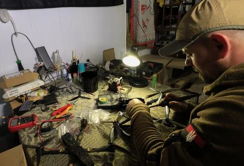 Servicemen of the special unit assembling and debugging FPV drones, Kharkiv, Ukr Stock Photos