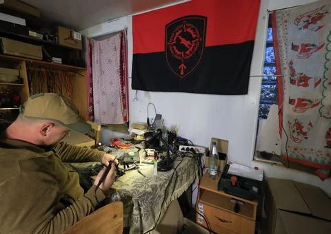 Servicemen of the special unit assembling and debugging FPV drones, Kharkiv, Ukr Stock Photos