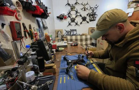 Servicemen of the special unit assembling and debugging FPV drones, Kharkiv, Ukr Stock Photos