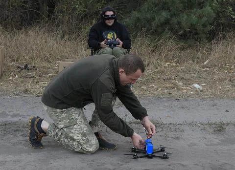 Servicemen of the special unit assembling and debugging FPV drones, Kharkiv, Ukr Stock Photos