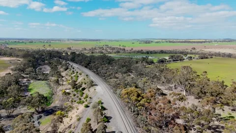 Serviceton railway passing through open farmland in Rowsley, Victoria Australia. 스톡 동영상 344909695