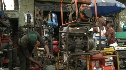 Servicing electricity generators, Lagos Stock Footage 38484694