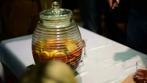 Serving alcohlic punch at the party Stock Footage 71119857