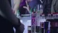 Serving alcohol drinks for visitors in night club HD Footage