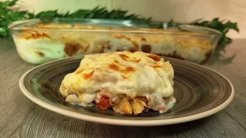 Serving and Eating Baked Macaroni Bechamel on Plate Stock-Footage 343927311