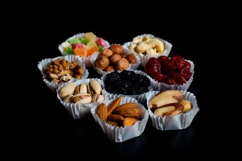 A serving of assorted candied fruit, dried cherries, almonds, raisins, walnut Stock Photos