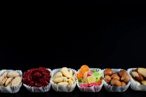 A serving of assorted candied fruit, dried cherries, almonds, raisins, walnut Stock Photos